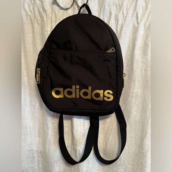 Never used Adidas backpack with gold letters. Lots of pockets. Great for school. - Picture 1 of 6